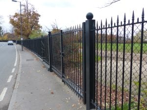 Railings on road by tennis club courts 